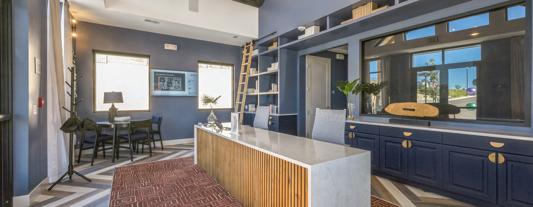 a clubroom with a table and chairs