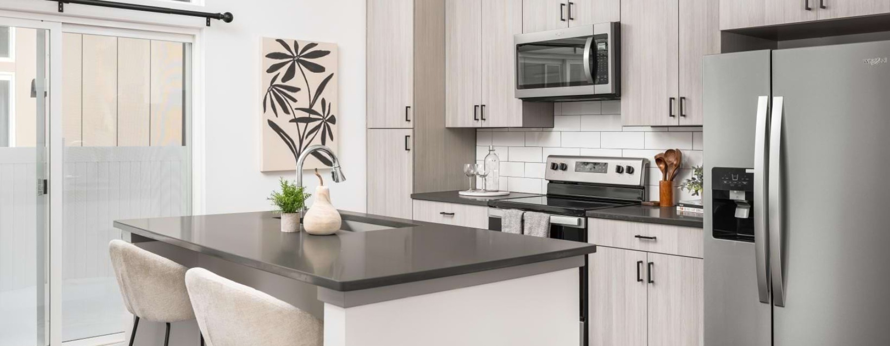 a kitchen with white cabinets