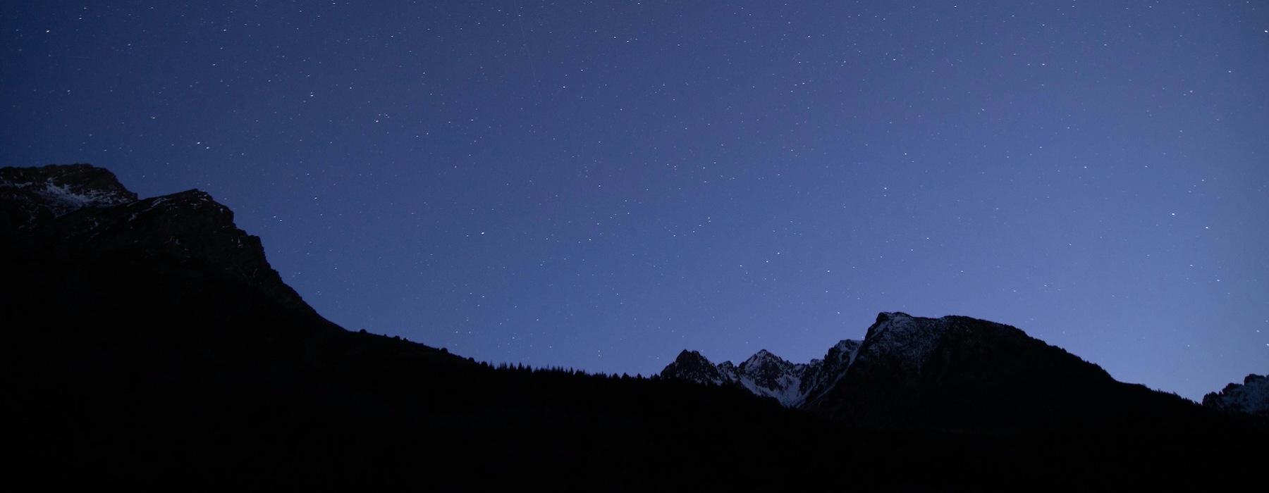 a mountain range at night